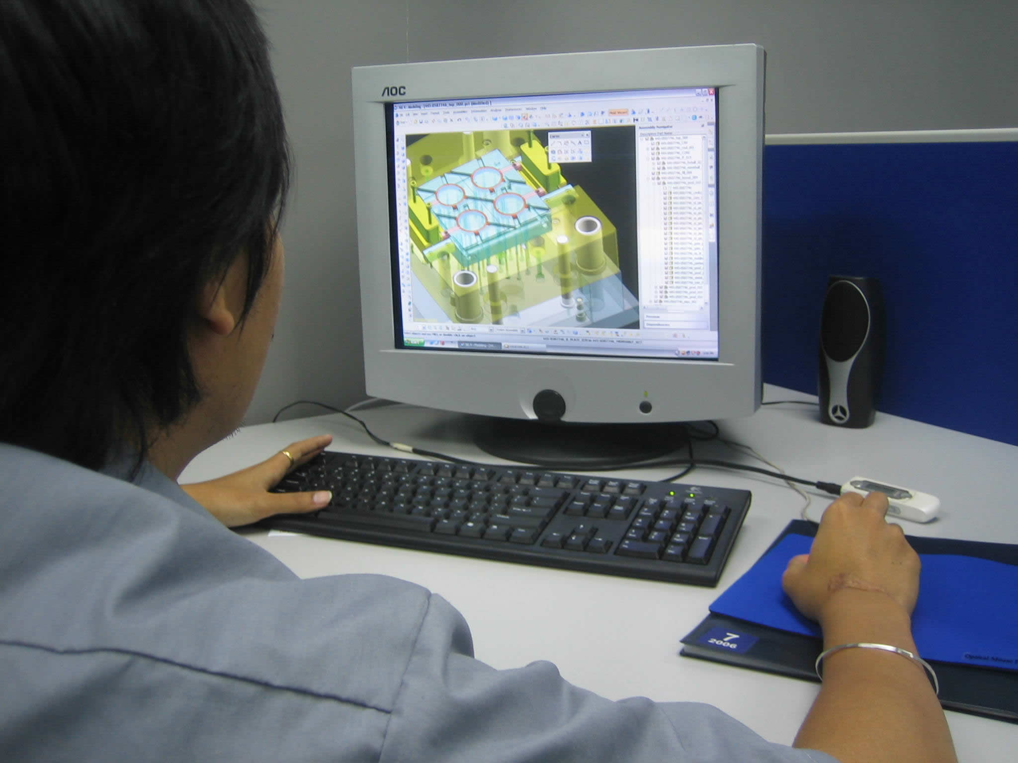 A tooling engineer designing a four-cavity mould in CAD